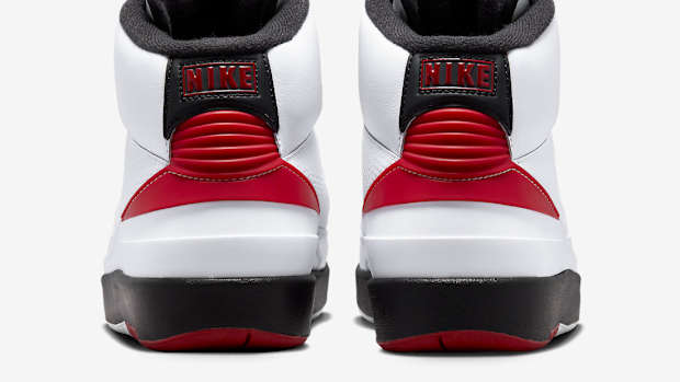 Rear view of white, red, and black Jordan shoes.